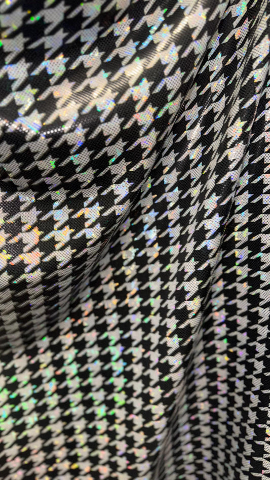 Houndstooth design on Shattered Glass metallic hologram nylon spandex White/Silver/Black  4-way stretch 58/60" Sold by the YD.