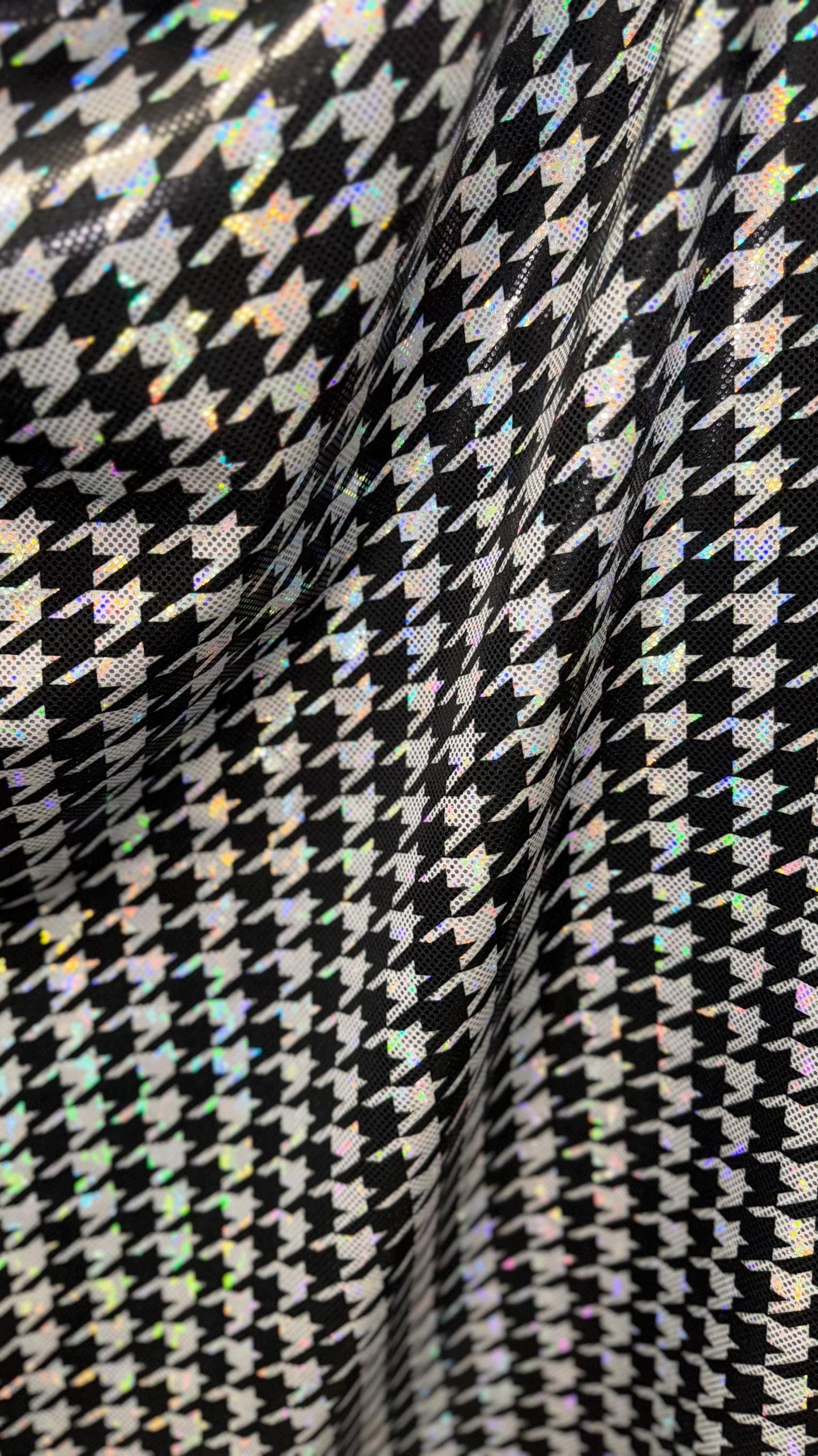 Houndstooth design on Shattered Glass metallic hologram nylon spandex White/Silver/Black  4-way stretch 58/60" Sold by the YD.