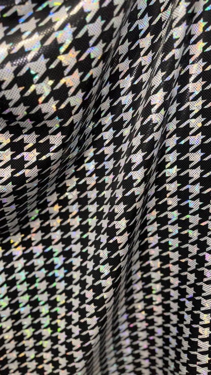 Houndstooth design on Shattered Glass metallic hologram nylon spandex White/Silver/Black  4-way stretch 58/60" Sold by the YD.