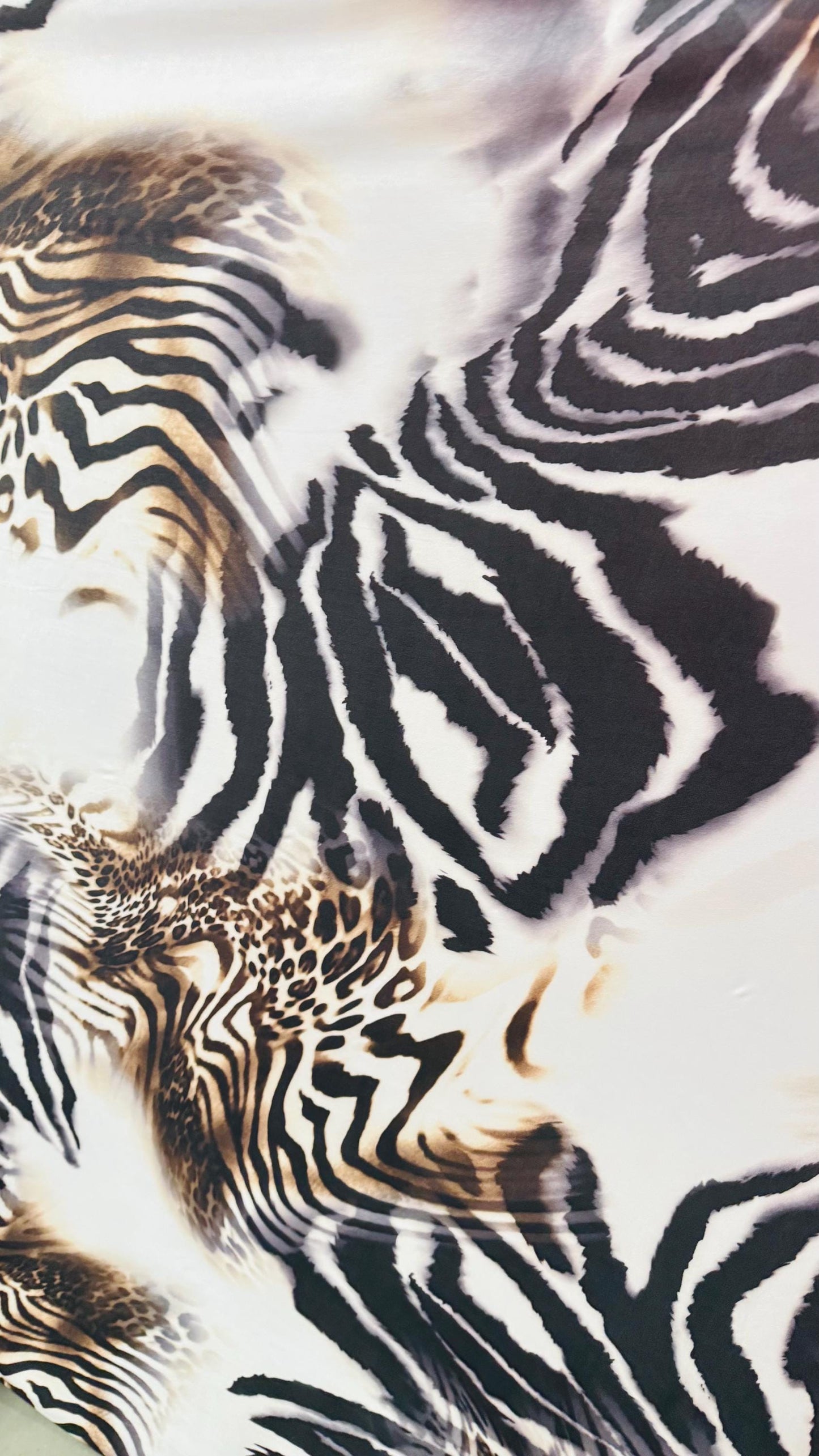 New Safari design Taupe/Brown print on poly spandex 4way stretch 58/60" Sold by the yd. Ships worldwide from Los Angeles California USA.