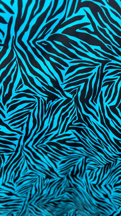 New zebra design turquois/Black print on nylon spandex 4way stretch 58/60" Sold by the YD. Ships worldwide from Los Angeles California USA.