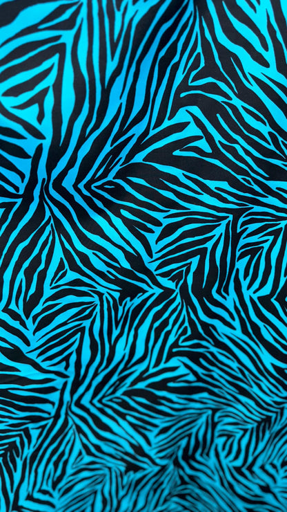 New zebra design turquois/Black print on nylon spandex 4way stretch 58/60" Sold by the YD. Ships worldwide from Los Angeles California USA.