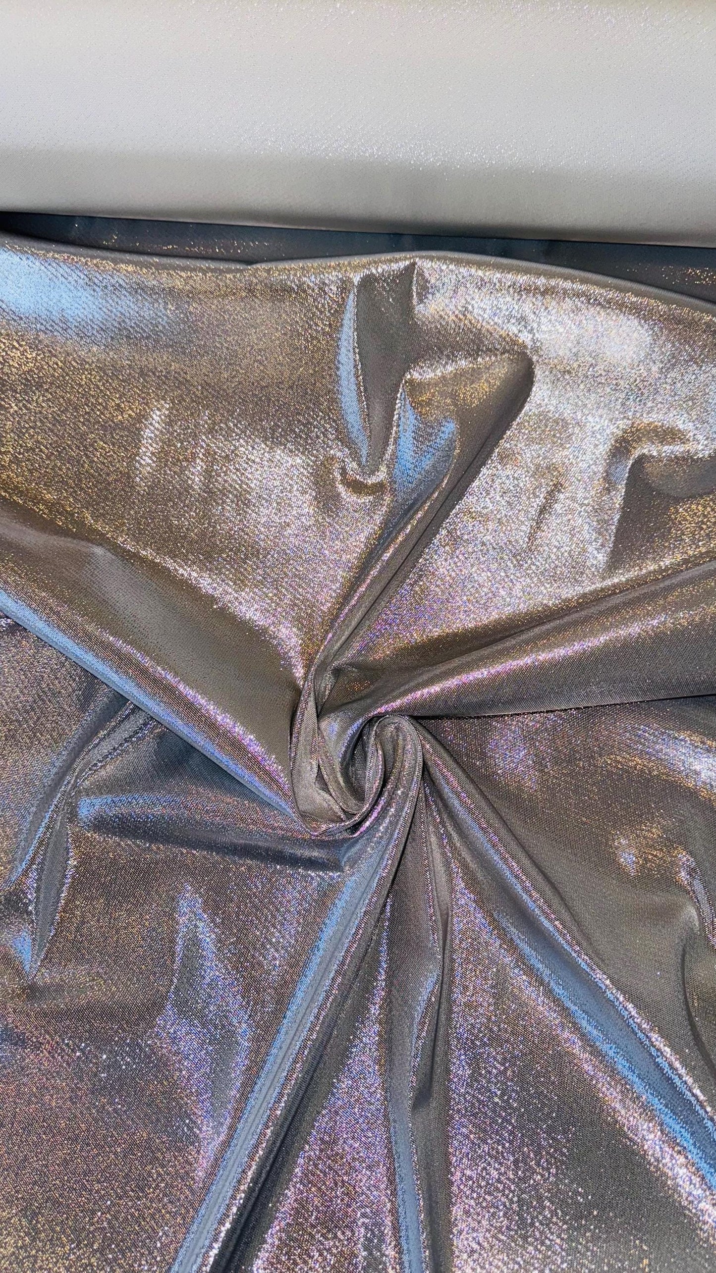 Silver Metallic Lame Lurex stretch super shiny  4-way stretch 45/46” Sold by the YD. Ships Worldwide from Los Angeles California USA.