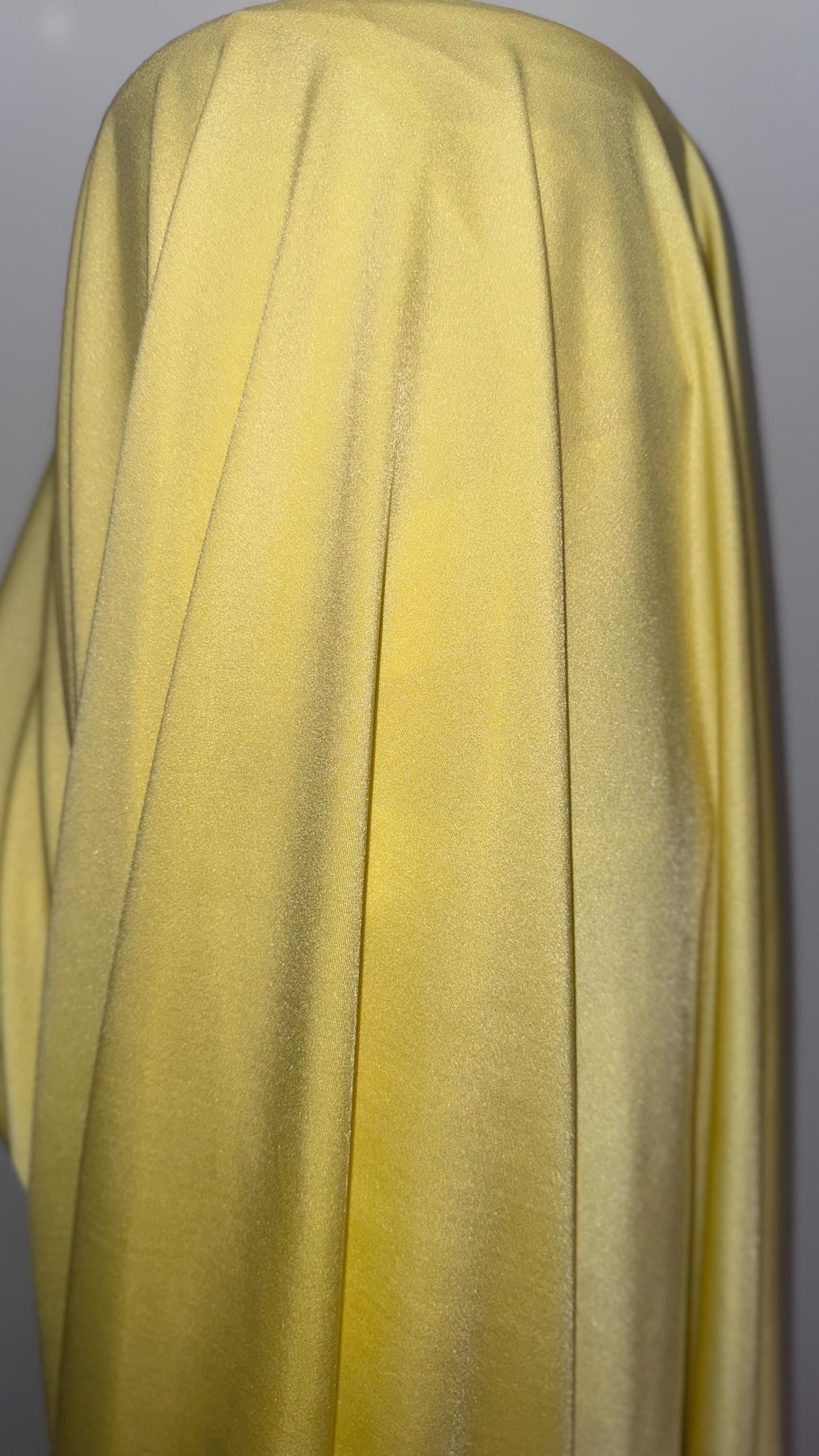 Great quality shiny Soft yellow  nylon spandex 4-way stretch 58/60” Sold by the YD. Ships worldwide from Los Ángeles California USA.