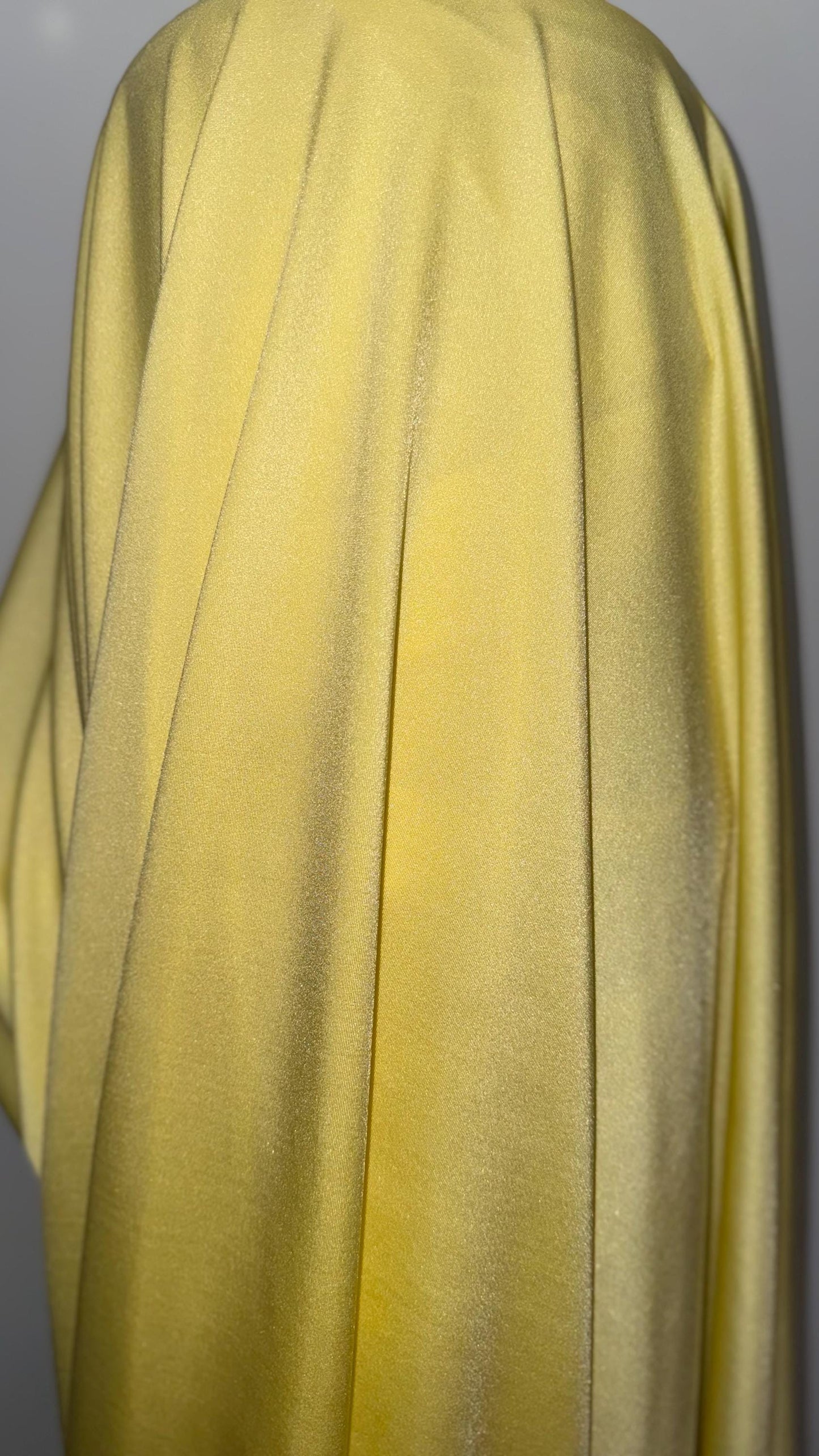 Great quality shiny Soft yellow  nylon spandex 4-way stretch 58/60” Sold by the YD. Ships worldwide from Los Ángeles California USA.