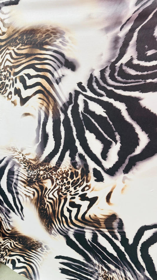New Safari design Taupe/Brown print on poly spandex 4way stretch 58/60" Sold by the yd. Ships worldwide from Los Angeles California USA.