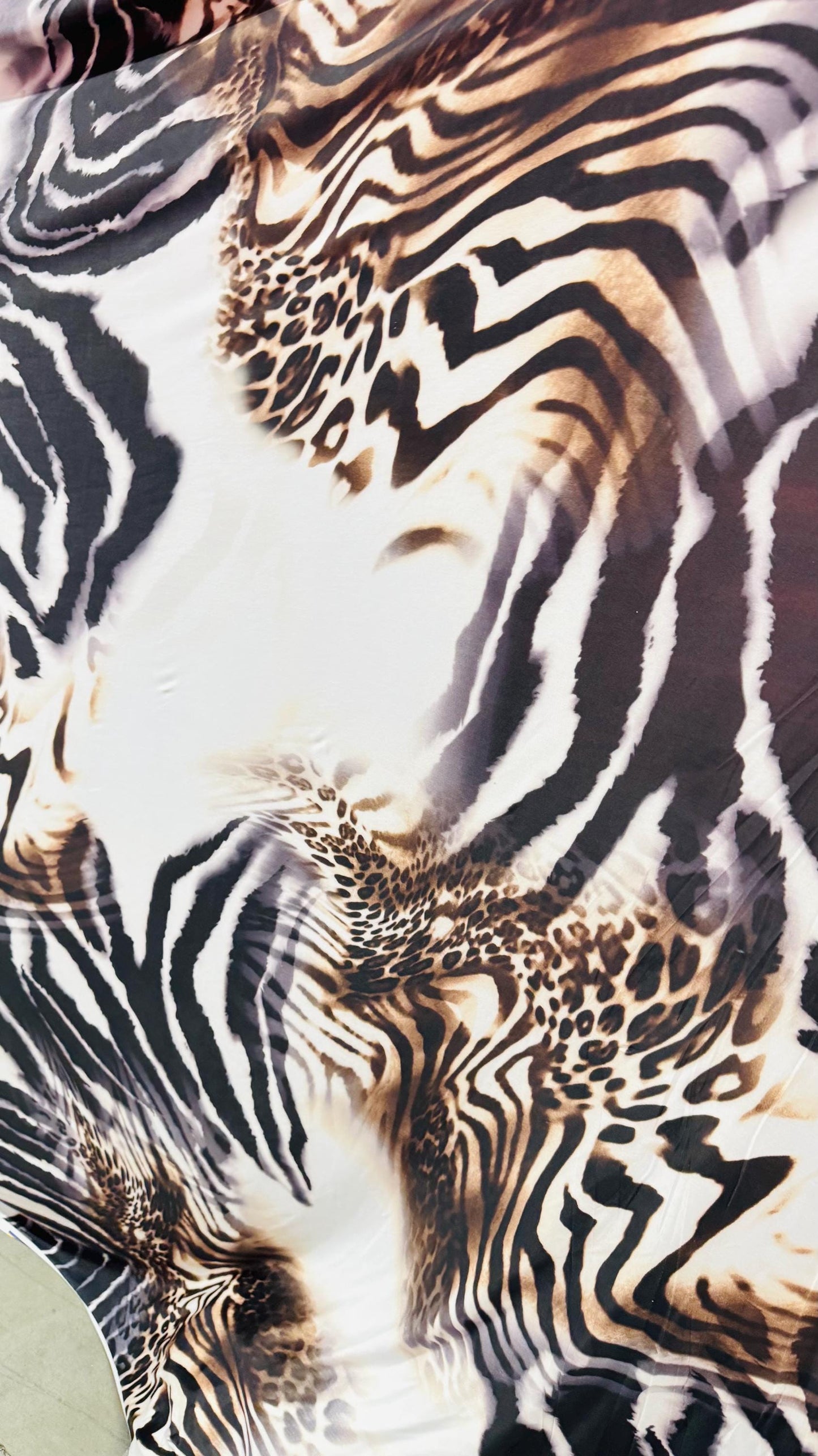 New Safari design Taupe/Brown print on poly spandex 4way stretch 58/60" Sold by the yd. Ships worldwide from Los Angeles California USA.