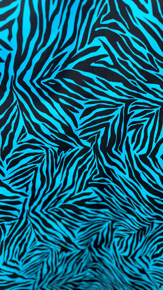 New zebra design turquois/Black print on nylon spandex 4way stretch 58/60" Sold by the YD. Ships worldwide from Los Angeles California USA.