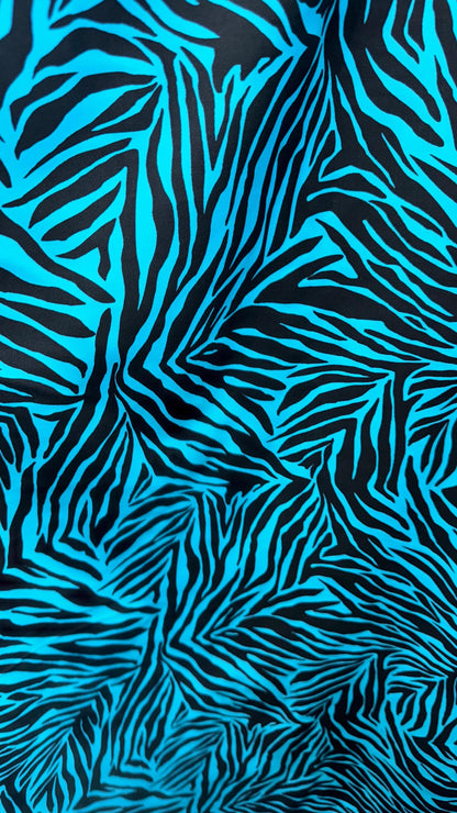 New zebra design turquois/Black print on nylon spandex 4way stretch 58/60" Sold by the YD. Ships worldwide from Los Angeles California USA.