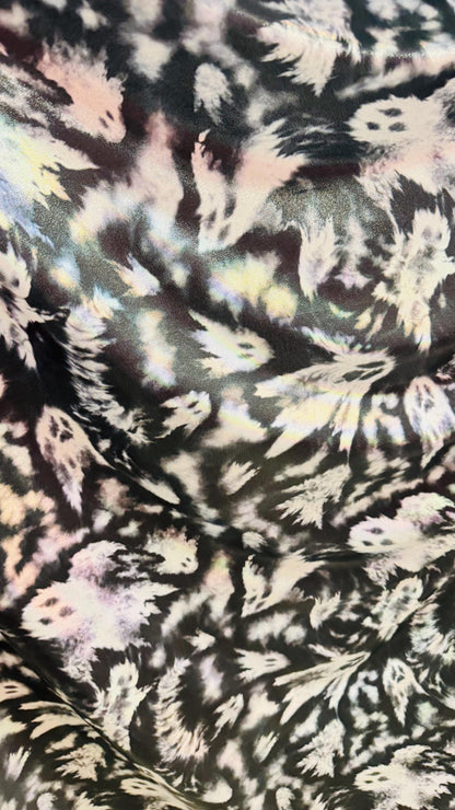 Ghost Hollowen design on Iridescent metallic nylon spandex with foggy foil 4-way stretch 58/60” Sold by the YD. Ships worldwide from LA CA