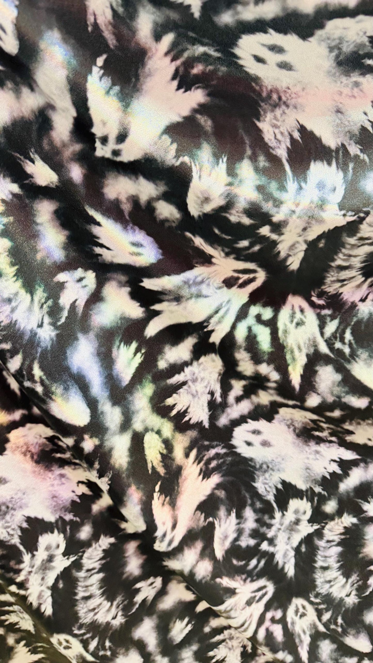Ghost Hollowen design on Iridescent metallic nylon spandex with foggy foil 4-way stretch 58/60” Sold by the YD. Ships worldwide from LA CA