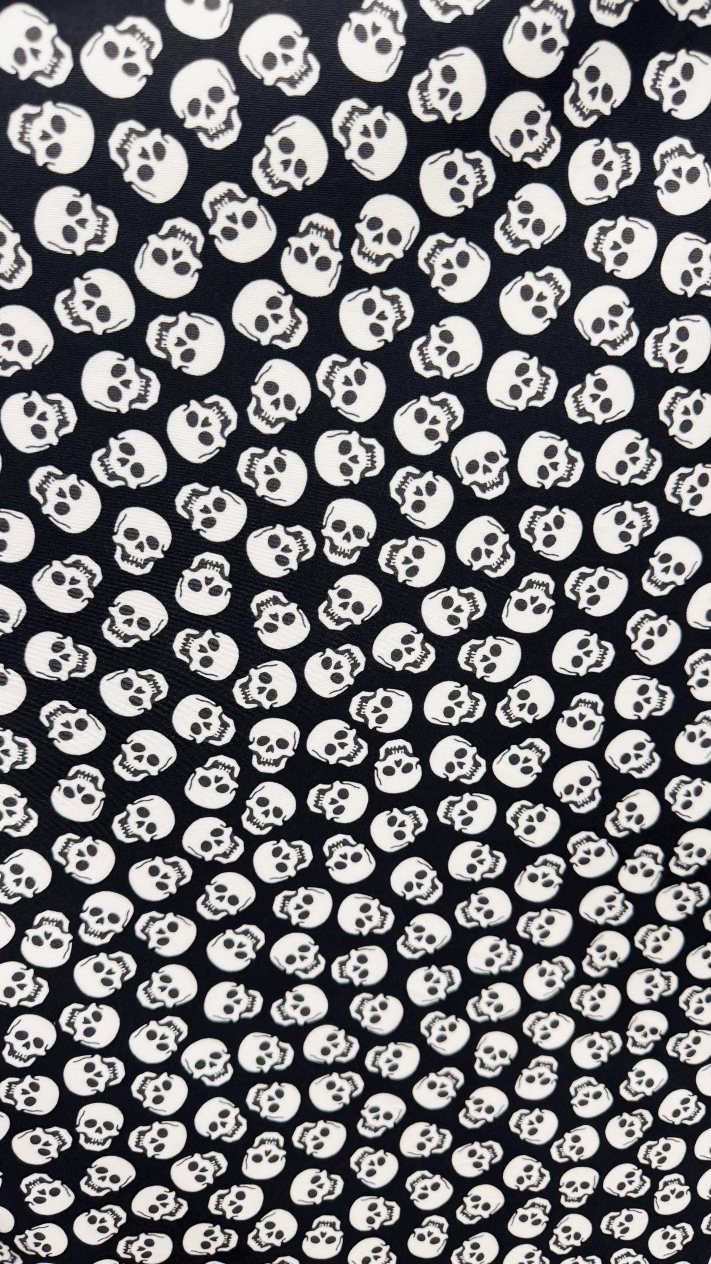 Skull Halloween design Black/White  print  on nylon spandex 4way stretch 58/60" sold by the yd. Ships worldwide from Los Angeles California