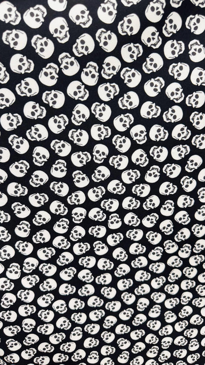 Skull Halloween design Black/White  print  on nylon spandex 4way stretch 58/60" sold by the yd. Ships worldwide from Los Angeles California