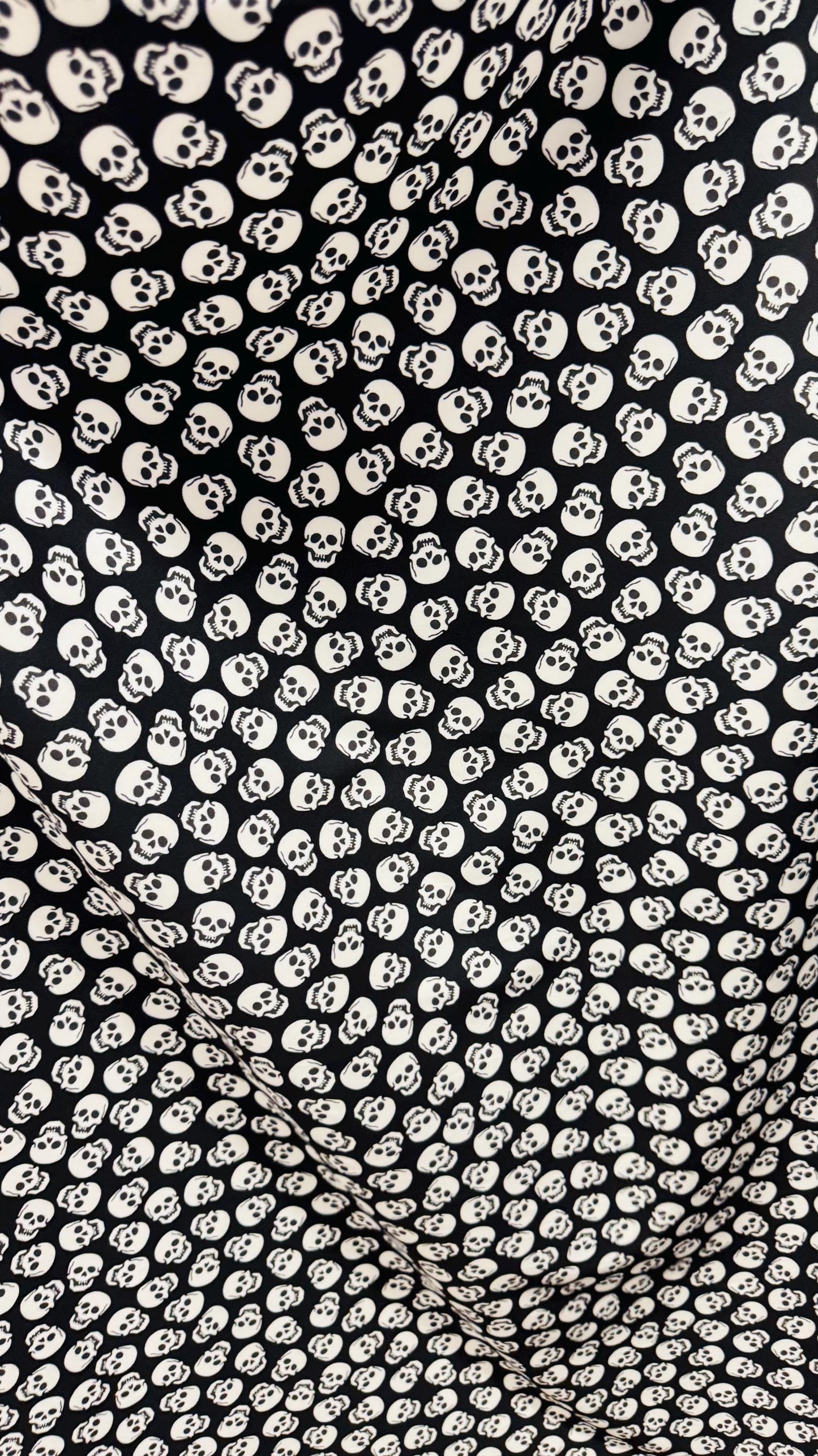 Skull Halloween design Black/White  print  on nylon spandex 4way stretch 58/60" sold by the yd. Ships worldwide from Los Angeles California