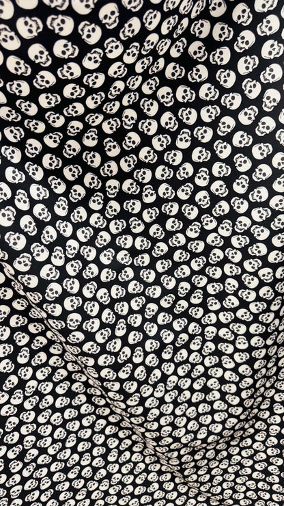 Skull Halloween design Black/White  print  on nylon spandex 4way stretch 58/60" sold by the yd. Ships worldwide from Los Angeles California