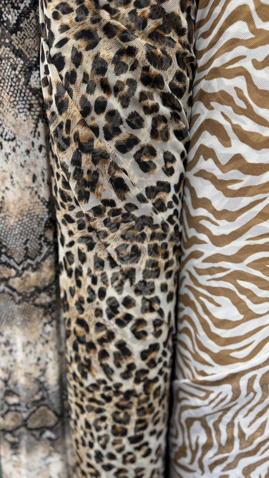 New Exotic Animals prints  designs pin power mesh  4-way stretch nylon spandex  58/60” Sold by the YD. Ships worldwide from Los Ángeles CA