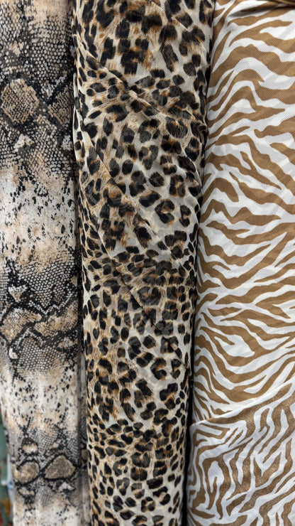 New Exotic Animals prints  designs pin power mesh  4-way stretch nylon spandex  58/60” Sold by the YD. Ships worldwide from Los Ángeles CA