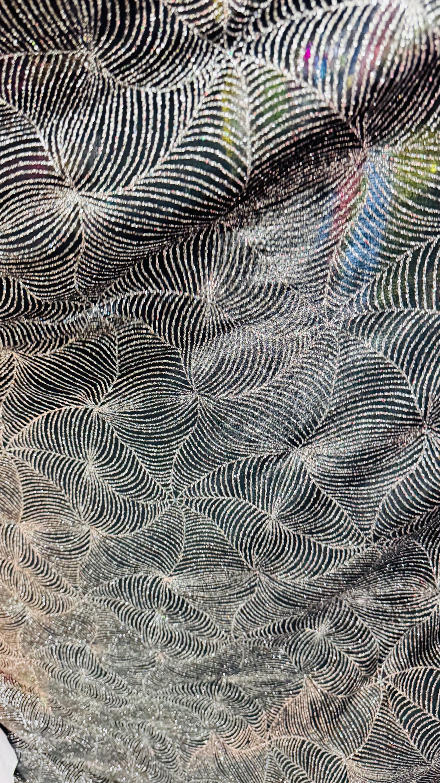 Slinky spider web design with glitter black/silver 4way stretch 58/60" Sold by the YD. Ships worldwide from Los Angeles California USA.