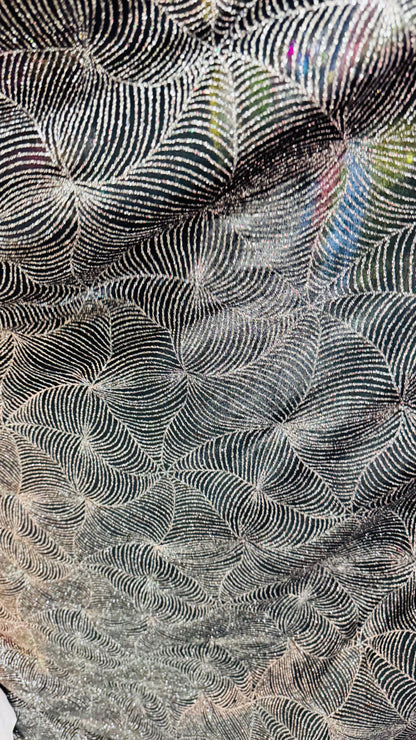 Slinky spider web design with glitter black/silver 4way stretch 58/60" Sold by the YD. Ships worldwide from Los Angeles California USA.