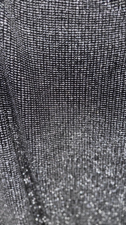 Slinky Geometric design with glitter black/silver 4way stretch 58/60" Sold by the YD. Ships worldwide from Los Angeles California USA.