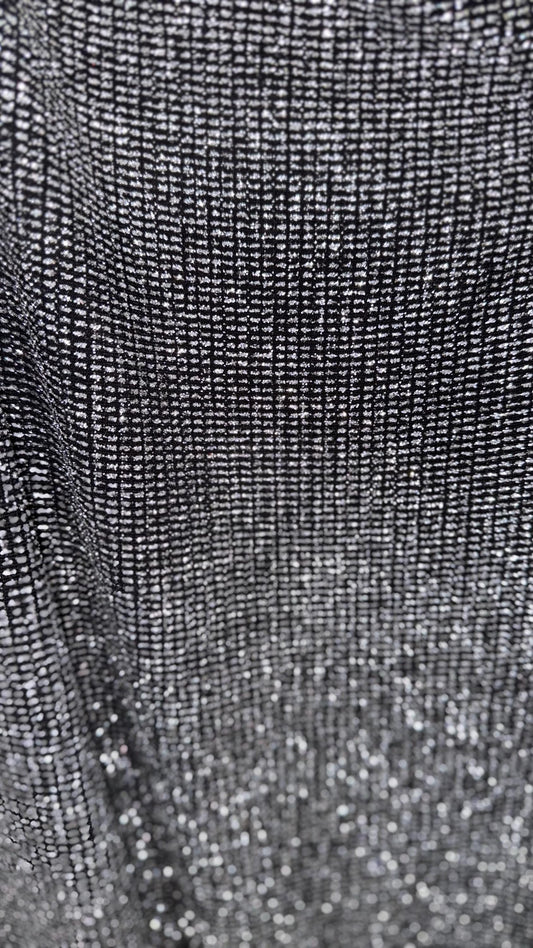 Slinky Geometric design with glitter black/silver 4way stretch 58/60" Sold by the YD. Ships worldwide from Los Angeles California USA.