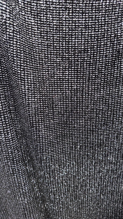 Slinky Geometric design with glitter black/silver 4way stretch 58/60" Sold by the YD. Ships worldwide from Los Angeles California USA.
