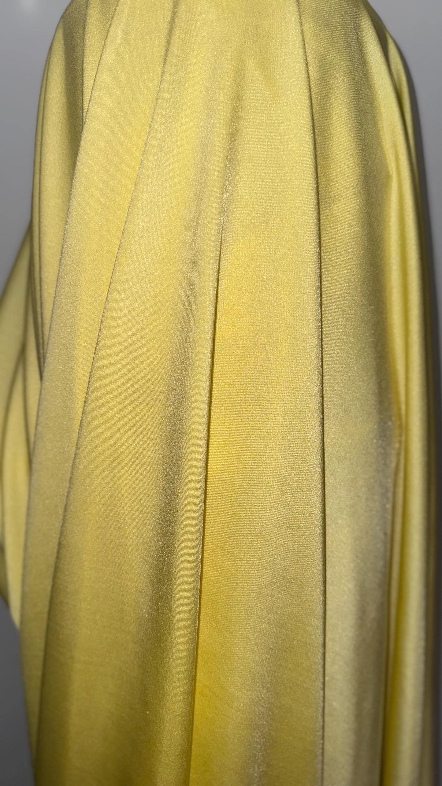 Great quality shiny Soft yellow  nylon spandex 4-way stretch 58/60” Sold by the YD. Ships worldwide from Los Ángeles California USA.