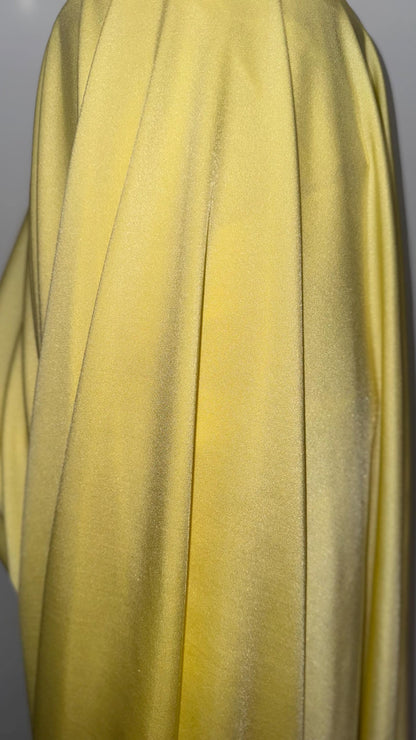Great quality shiny Soft yellow  nylon spandex 4-way stretch 58/60” Sold by the YD. Ships worldwide from Los Ángeles California USA.