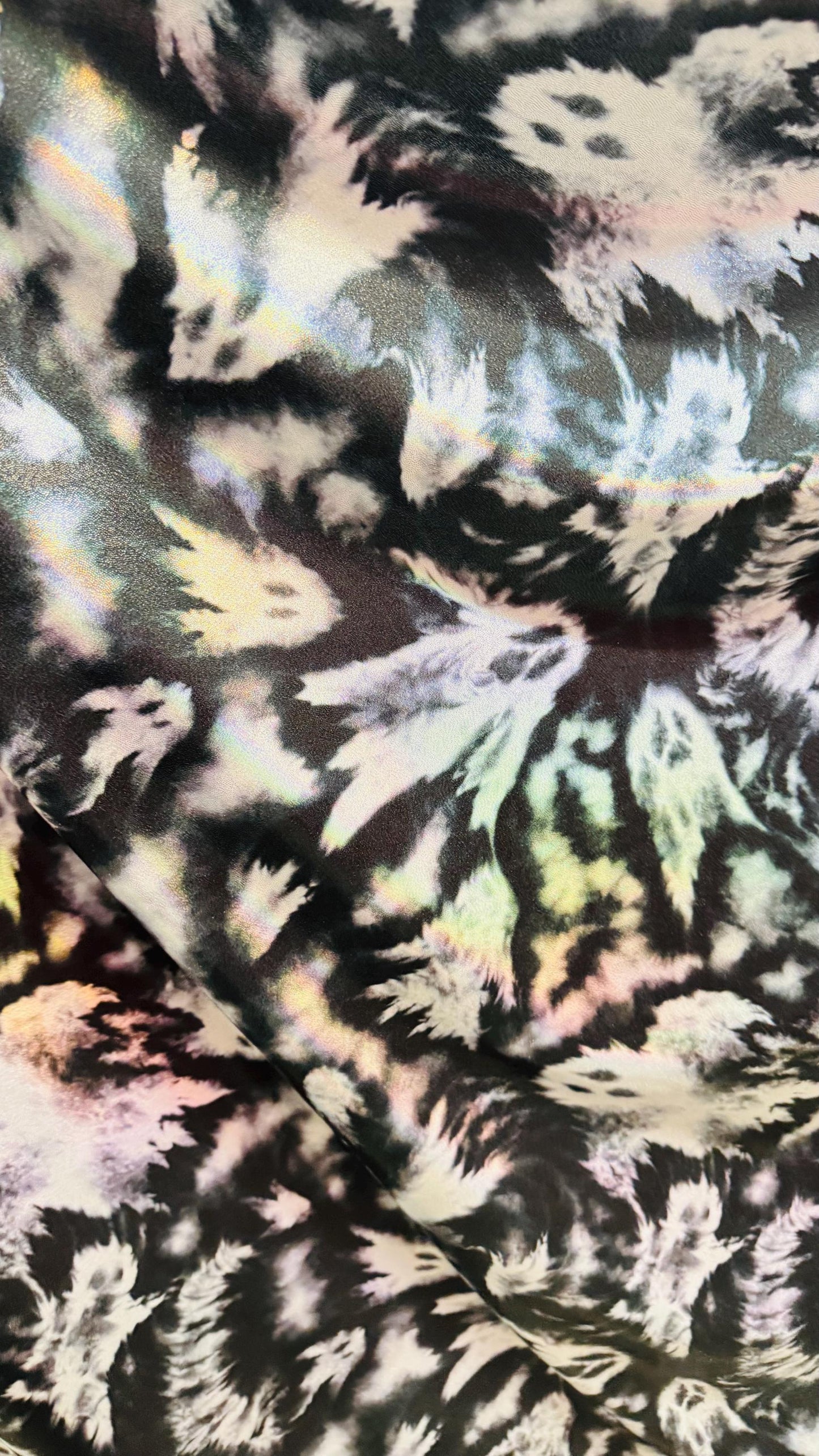Ghost Hollowen design on Iridescent metallic nylon spandex with foggy foil 4-way stretch 58/60” Sold by the YD. Ships worldwide from LA CA