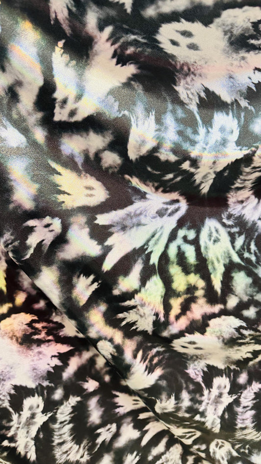 Ghost Hollowen design on Iridescent metallic nylon spandex with foggy foil 4-way stretch 58/60” Sold by the YD. Ships worldwide from LA CA
