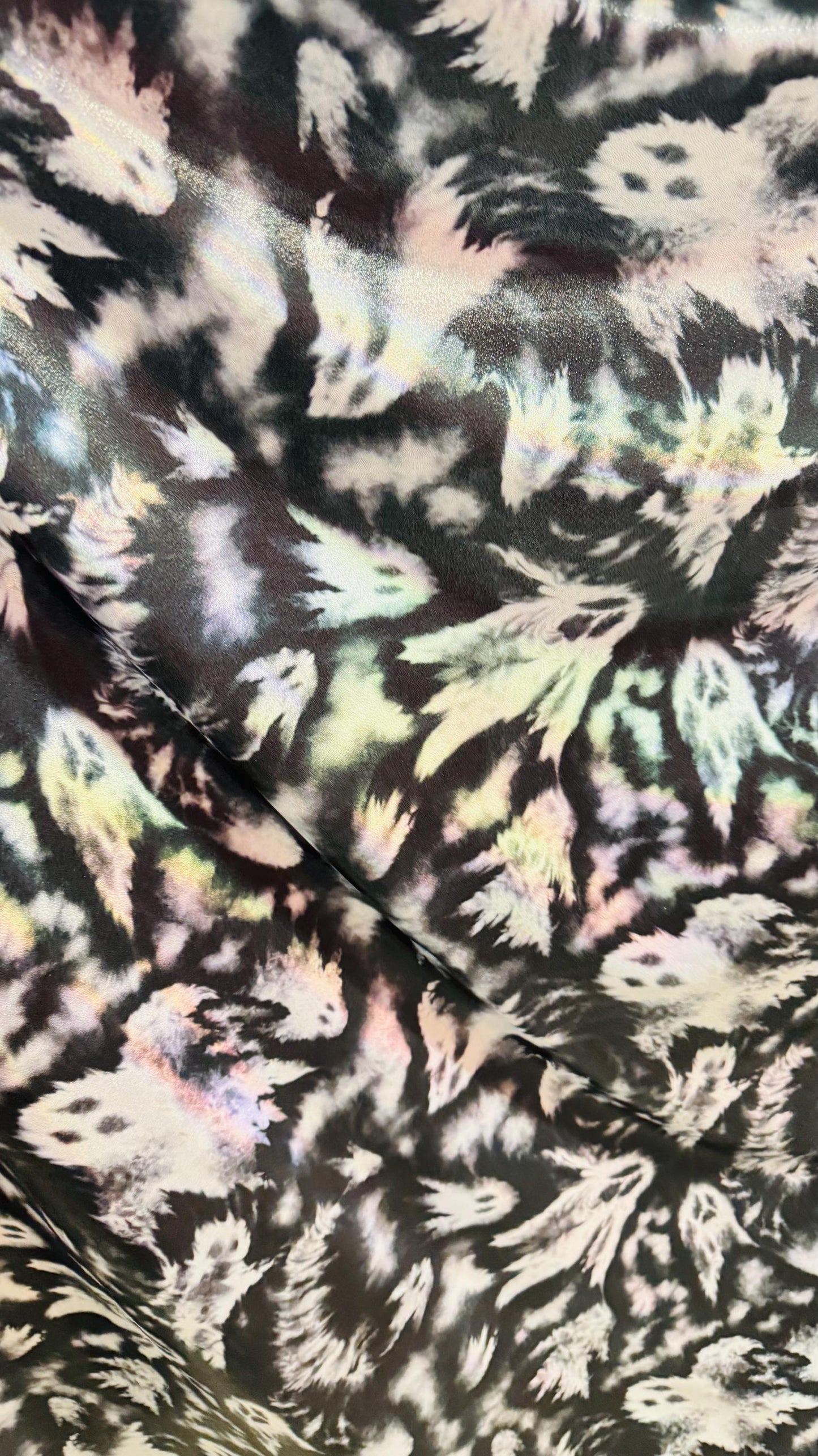 Ghost Hollowen design on Iridescent metallic nylon spandex with foggy foil 4-way stretch 58/60” Sold by the YD. Ships worldwide from LA CA