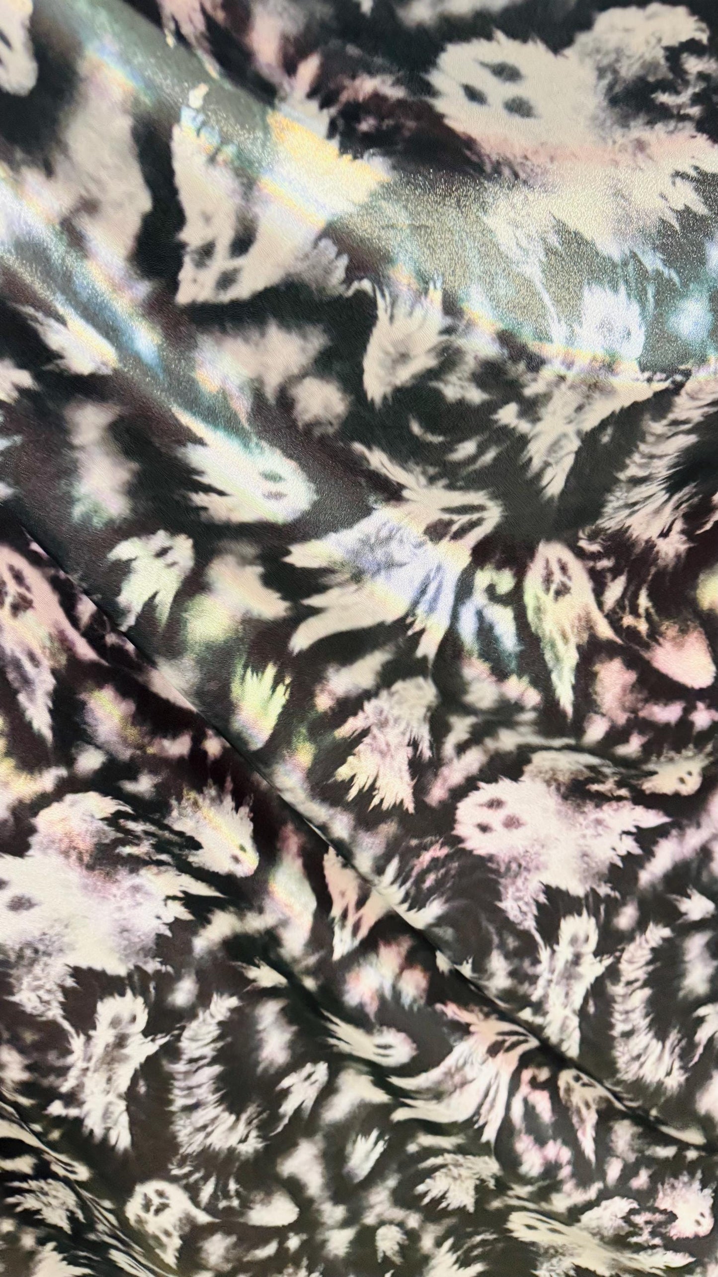 Ghost Hollowen design on Iridescent metallic nylon spandex with foggy foil 4-way stretch 58/60” Sold by the YD. Ships worldwide from LA CA
