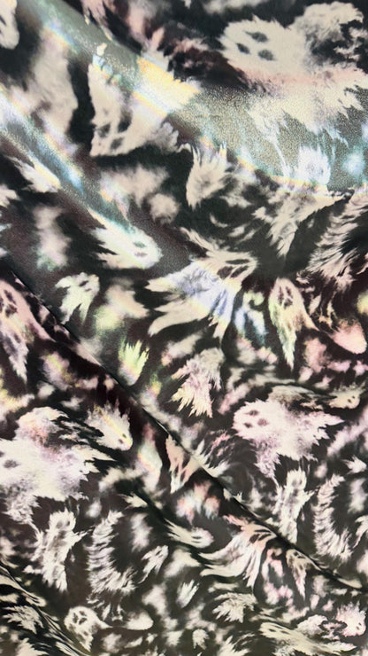 Ghost Hollowen design on Iridescent metallic nylon spandex with foggy foil 4-way stretch 58/60” Sold by the YD. Ships worldwide from LA CA
