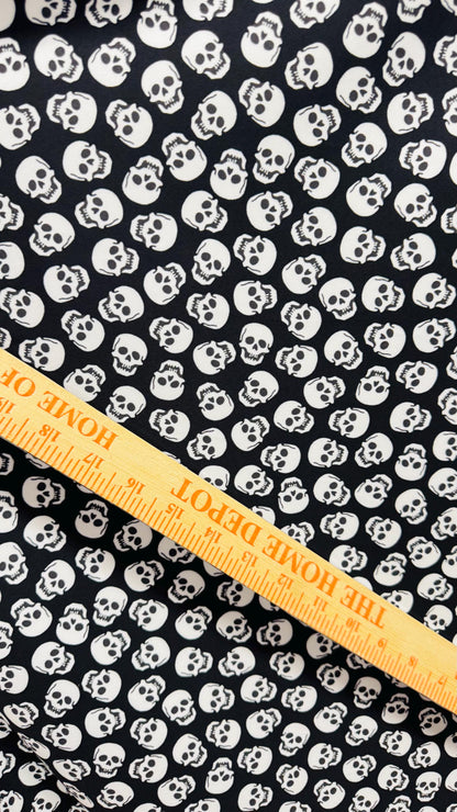 Skull Halloween design Black/White  print  on nylon spandex 4way stretch 58/60" sold by the yd. Ships worldwide from Los Angeles California
