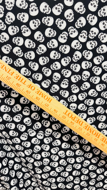 Skull Halloween design Black/White  print  on nylon spandex 4way stretch 58/60" sold by the yd. Ships worldwide from Los Angeles California