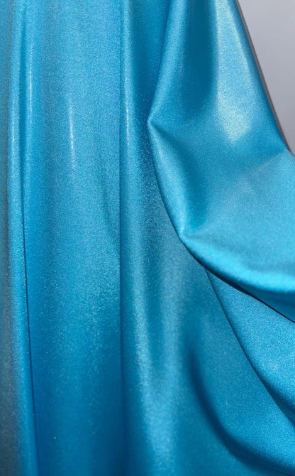 New foggy foil metallic nylon spandex Aqua color 4way Stretch 58/60" Sold by the YD. Ships worldwide from Los Angeles California USA.
