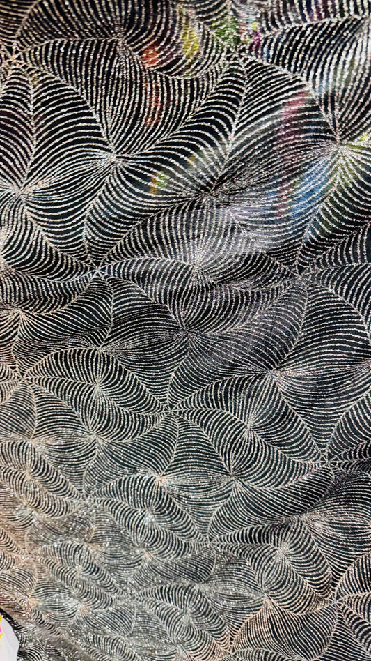 Slinky spider web design with glitter black/silver 4way stretch 58/60" Sold by the YD. Ships worldwide from Los Angeles California USA.