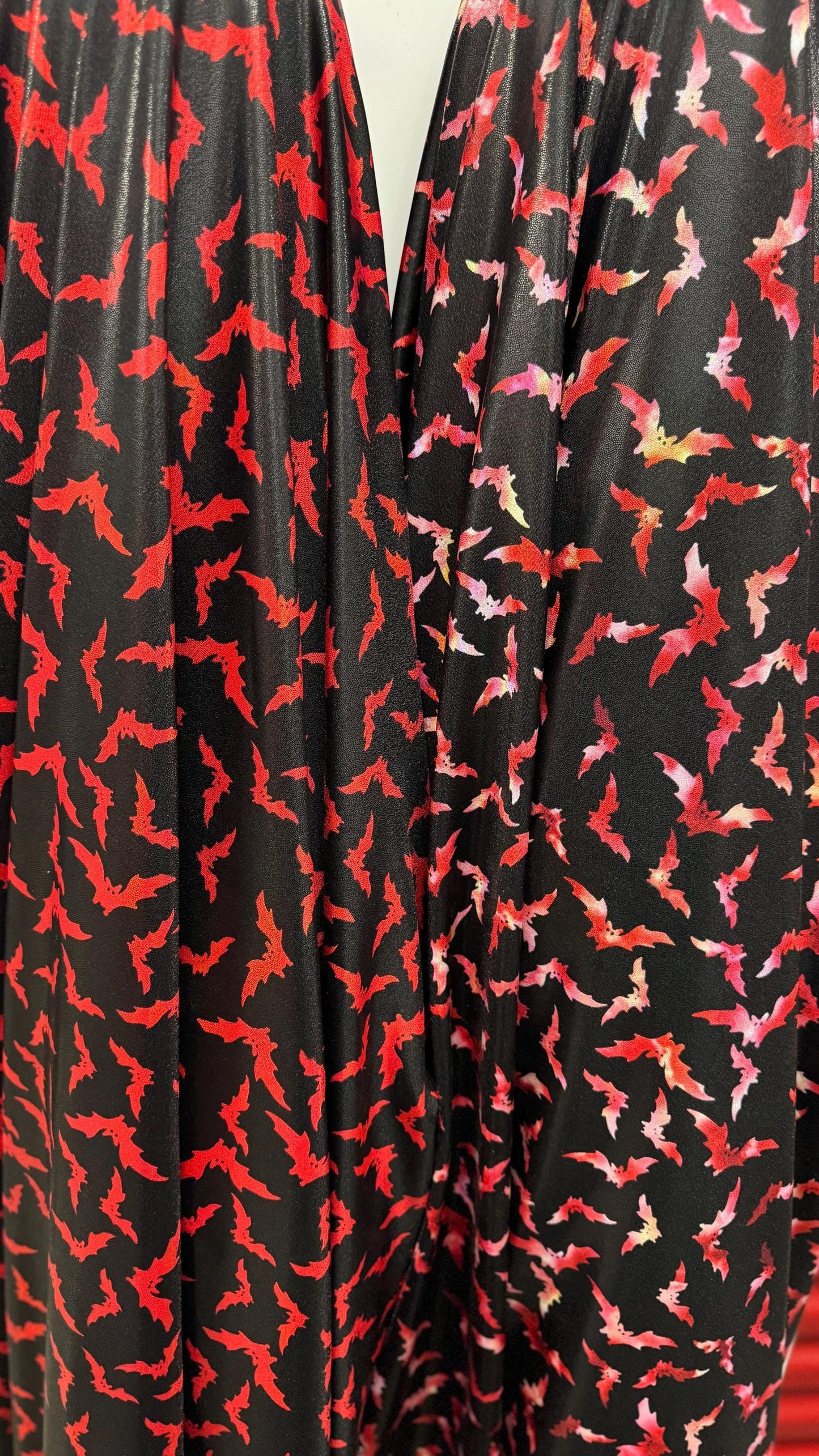 New Bats design on Iridescent metallic nylon spandex with foggy foil  4way stretch 58/60" Sold by the YD. Ships worldwide from Los Angeles