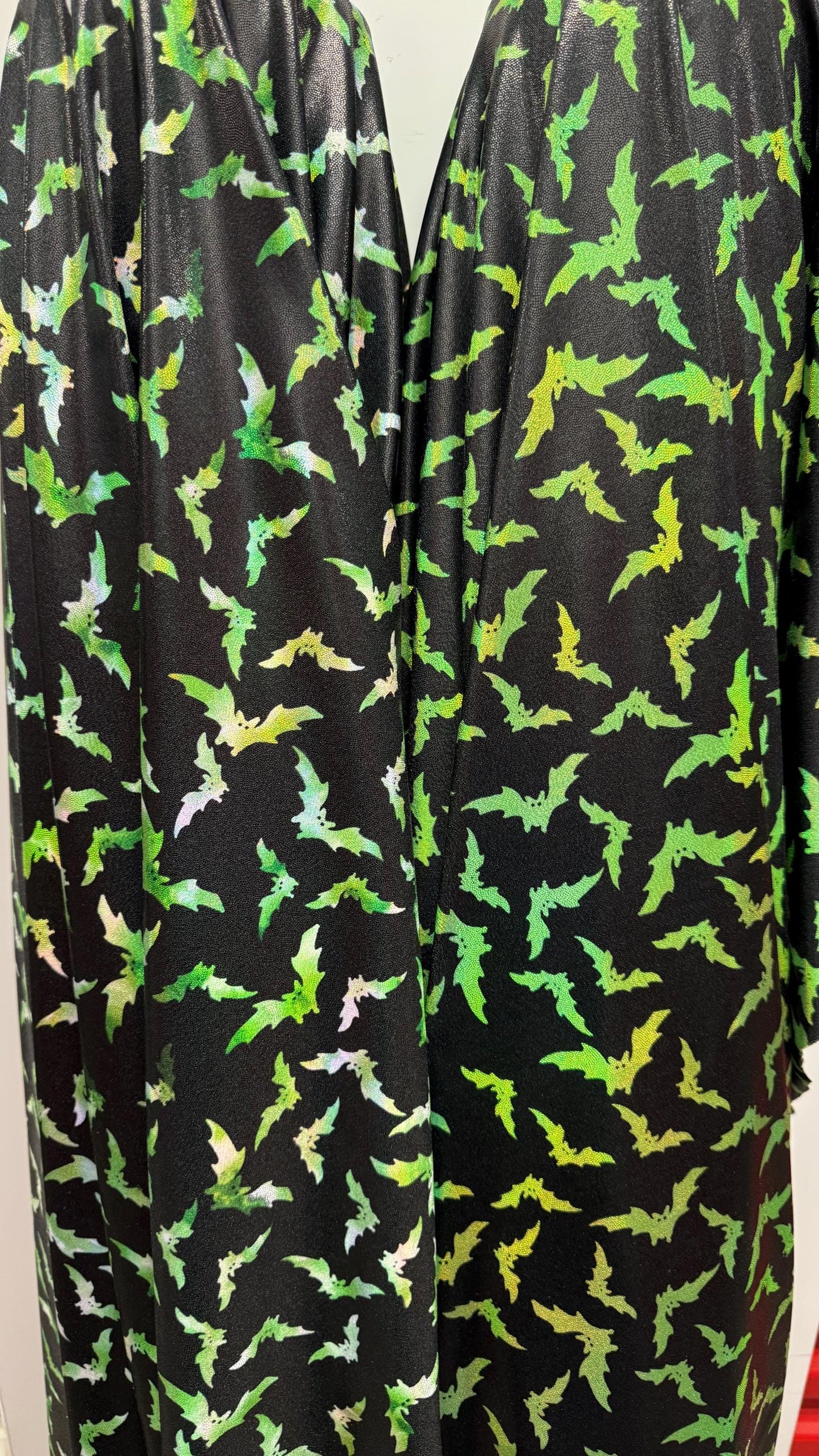 New Bats design on Iridescent metallic nylon spandex with foggy foil  4way stretch 58/60" Sold by the YD. Ships worldwide from Los Angeles
