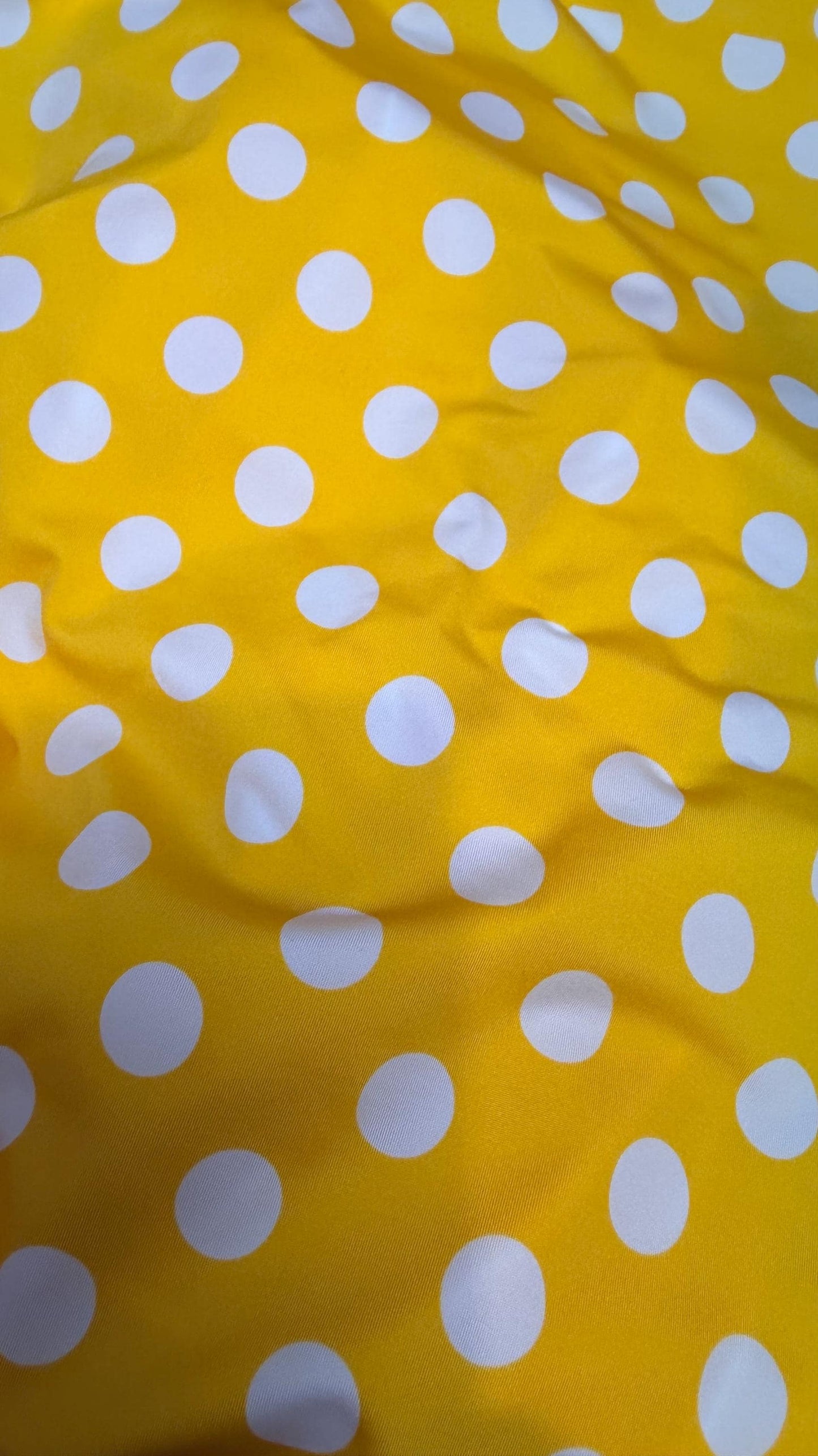 Polka dots print medium size on nylon spandex 4way stretch  58/60" sold by the Yd. Ships worldwide from Los Angeles California USA.