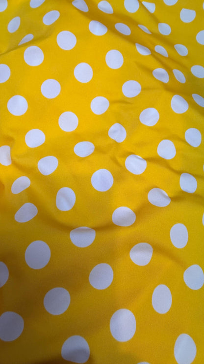 Polka dots print medium size on nylon spandex 4way stretch  58/60" sold by the Yd. Ships worldwide from Los Angeles California USA.
