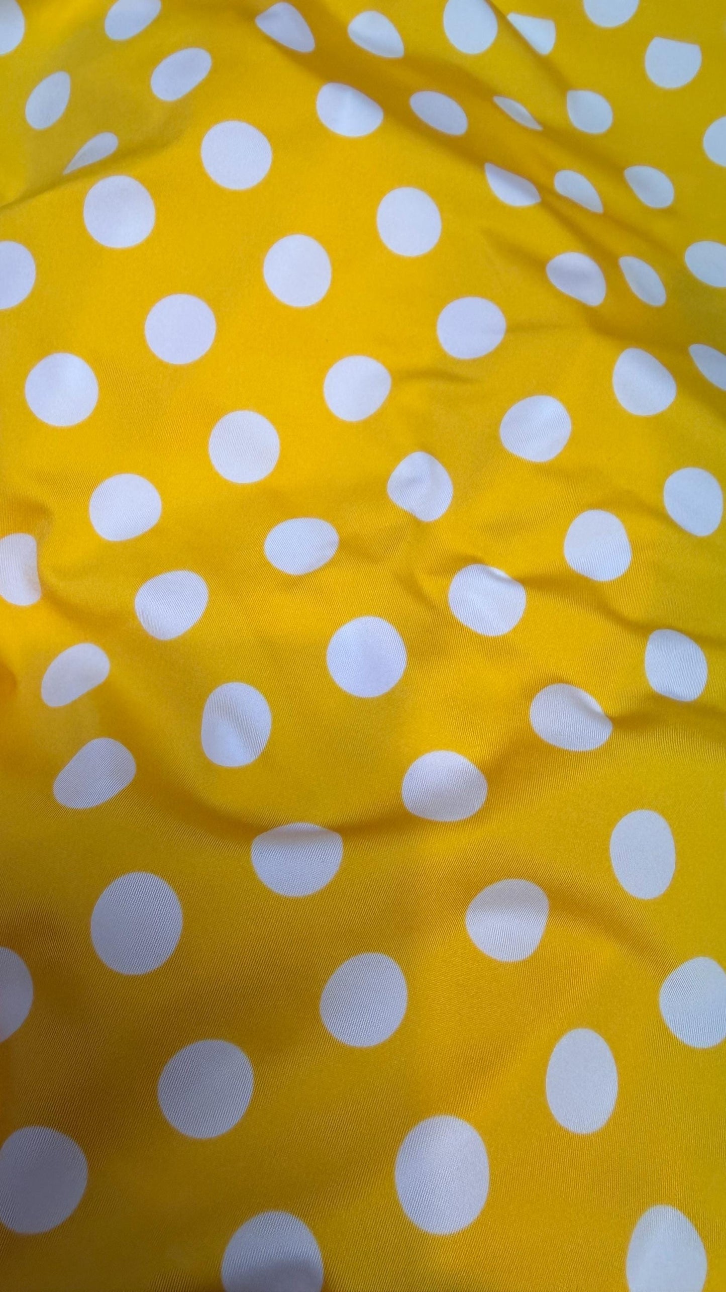Polka dots print medium size on nylon spandex 4way stretch  58/60" sold by the Yd. Ships worldwide from Los Angeles California USA.