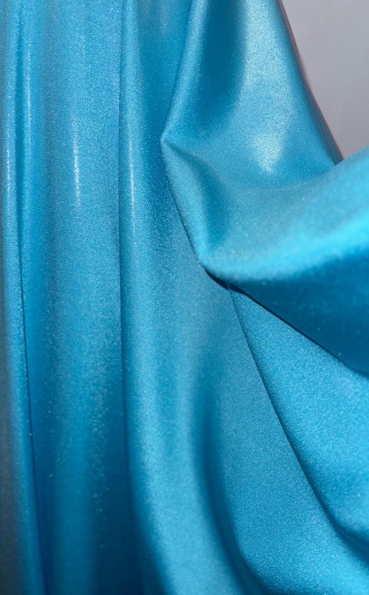 New foggy foil metallic nylon spandex Aqua color 4way Stretch 58/60" Sold by the YD. Ships worldwide from Los Angeles California USA.