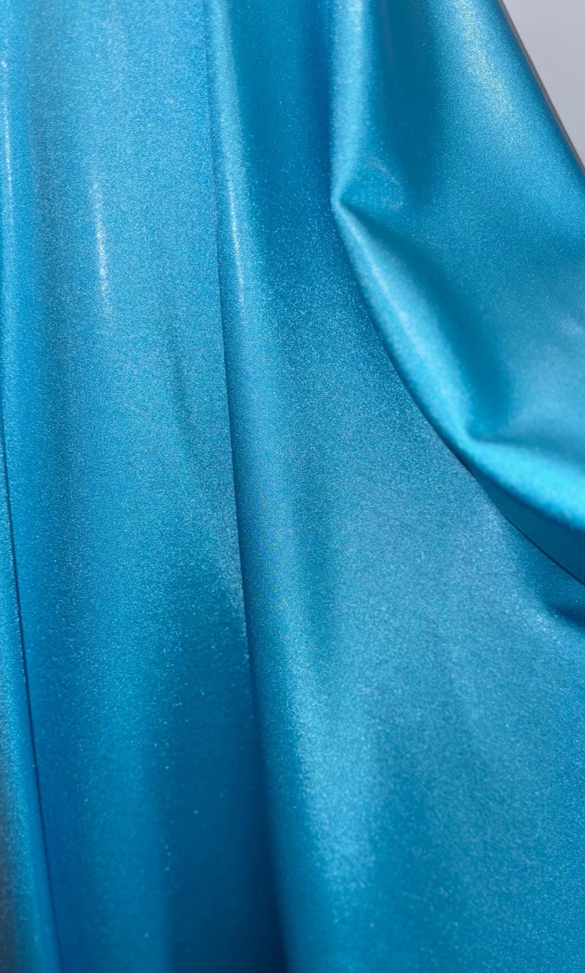 New foggy foil metallic nylon spandex Aqua color 4way Stretch 58/60" Sold by the YD. Ships worldwide from Los Angeles California USA.