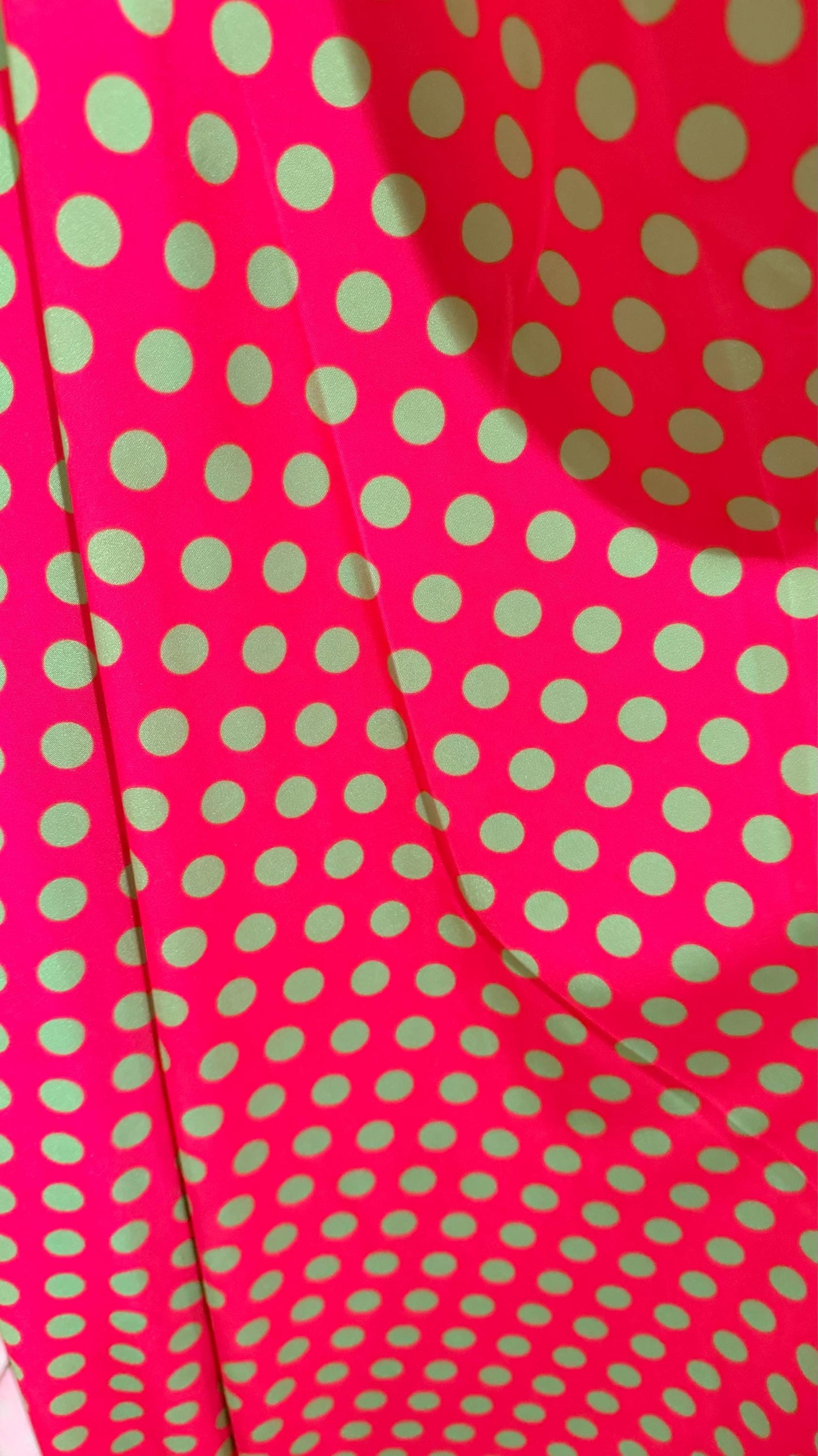 Polka dots design print on shiny  nylon spandex 4way stretch  58/60" sold by the Yd. Ships worldwide from Los Angeles California USA.