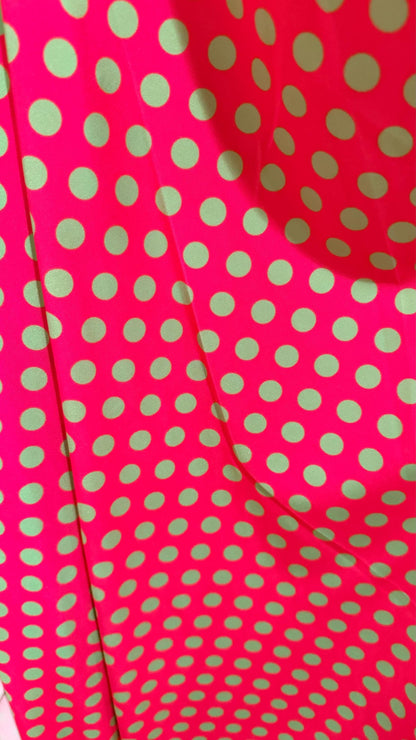 Polka dots design print on shiny  nylon spandex 4way stretch  58/60" sold by the Yd. Ships worldwide from Los Angeles California USA.