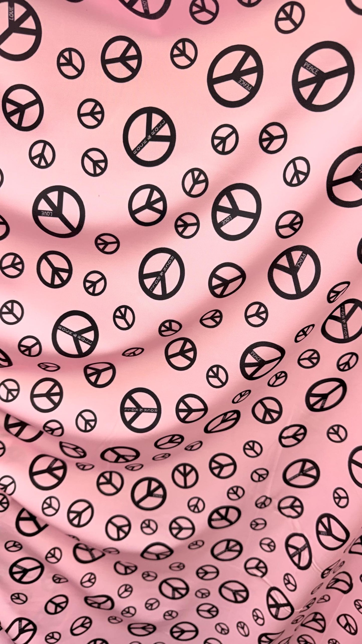 Love and Peace design print on great quality of nylon spandex 4way stretch 58/60" Sold by the YD. Ships worldwide from Los Angeles CA USA