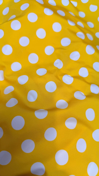 Polka dots print medium size on nylon spandex 4way stretch  58/60" sold by the Yd. Ships worldwide from Los Angeles California USA.