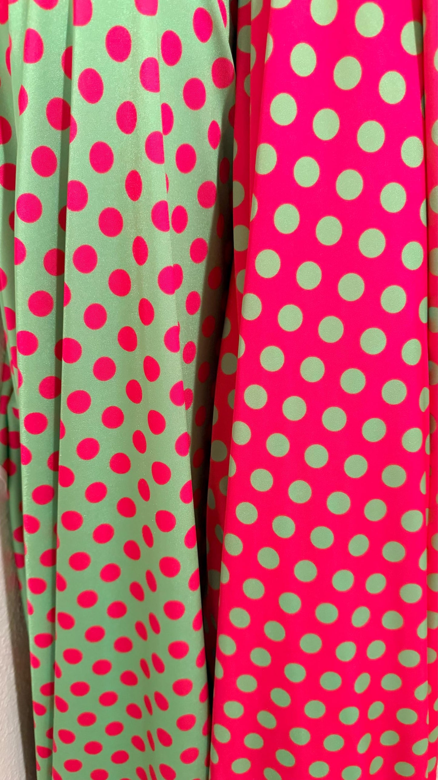 Polka dots design print on shiny  nylon spandex 4way stretch  58/60" sold by the Yd. Ships worldwide from Los Angeles California USA.