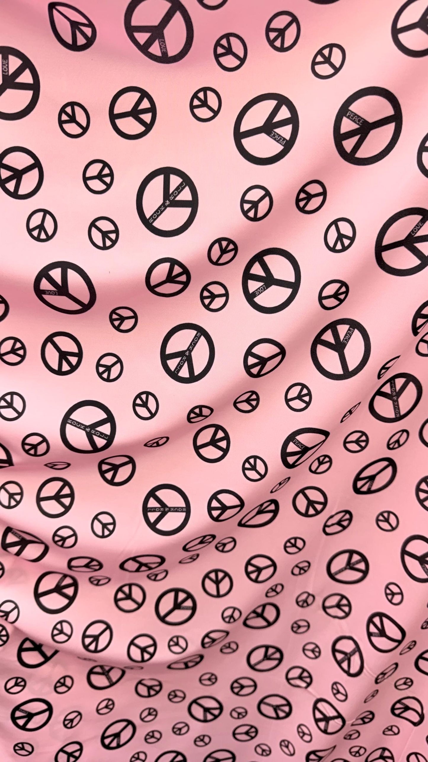 Love and Peace design print on great quality of nylon spandex 4way stretch 58/60" Sold by the YD. Ships worldwide from Los Angeles CA USA